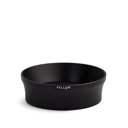 Fellow Espresso 58 mm Magnetic Dosing Funnel, black and round with logo on the side.