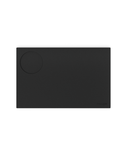 Fellow Espresso Tamping Mat: rectangular silicone mat with circular indentation for espresso.